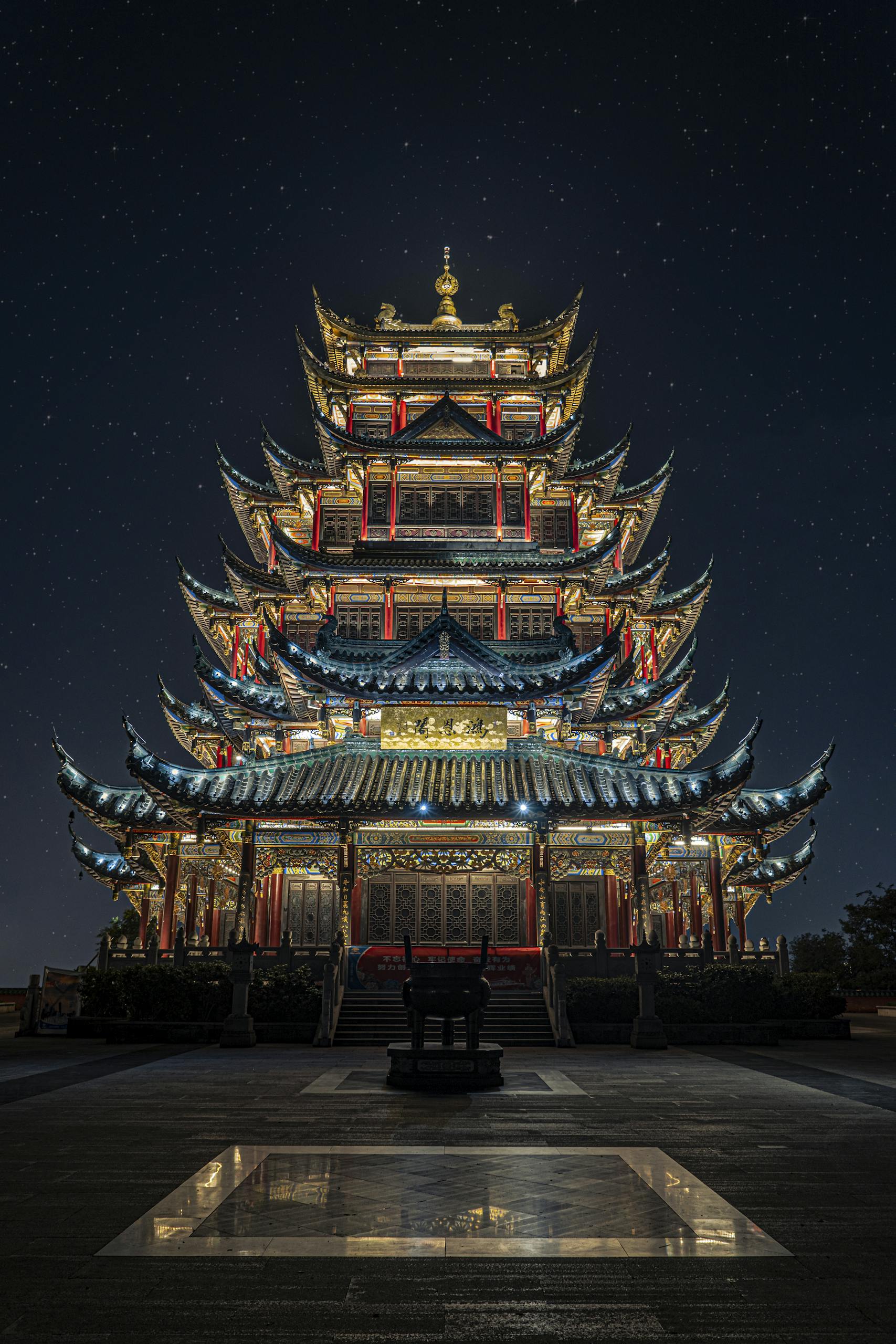 Illuminated pagoda temple in Chongqing at nighttime