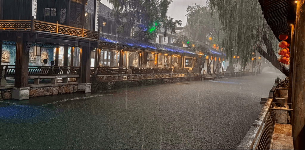 Canal-side traditional architecture in a Jiangnan water town, mist-soft light