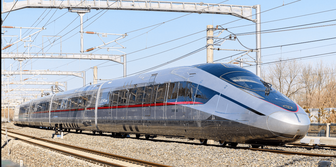 Fuxing Hao CR400AF high-speed bullet train running on railway tracks in China under a blue sky.