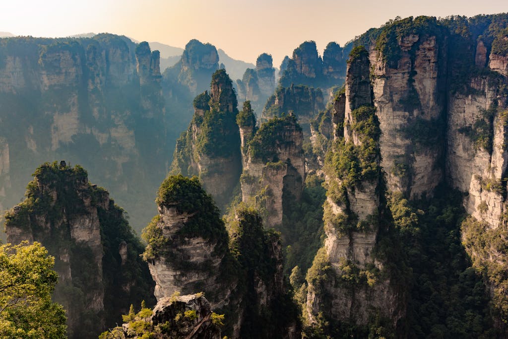 Stunning aerial view of Zhangjiajie's towering sandstone pillars under daylight.