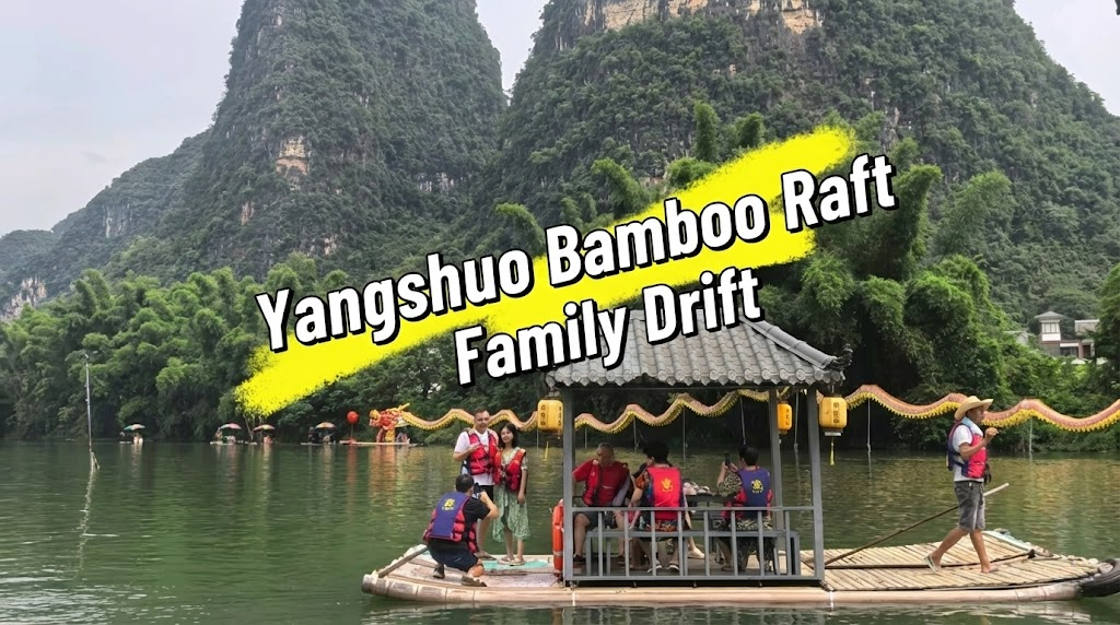 A group of tourists wearing red life jackets on a large, roofed bamboo raft drifting on a river in Yangshuo, China. A raftsman steers the boat against a backdrop of steep karst mountains and lush bamboo. Text overlay reads "Yangshuo Bamboo Raft Family Drift".