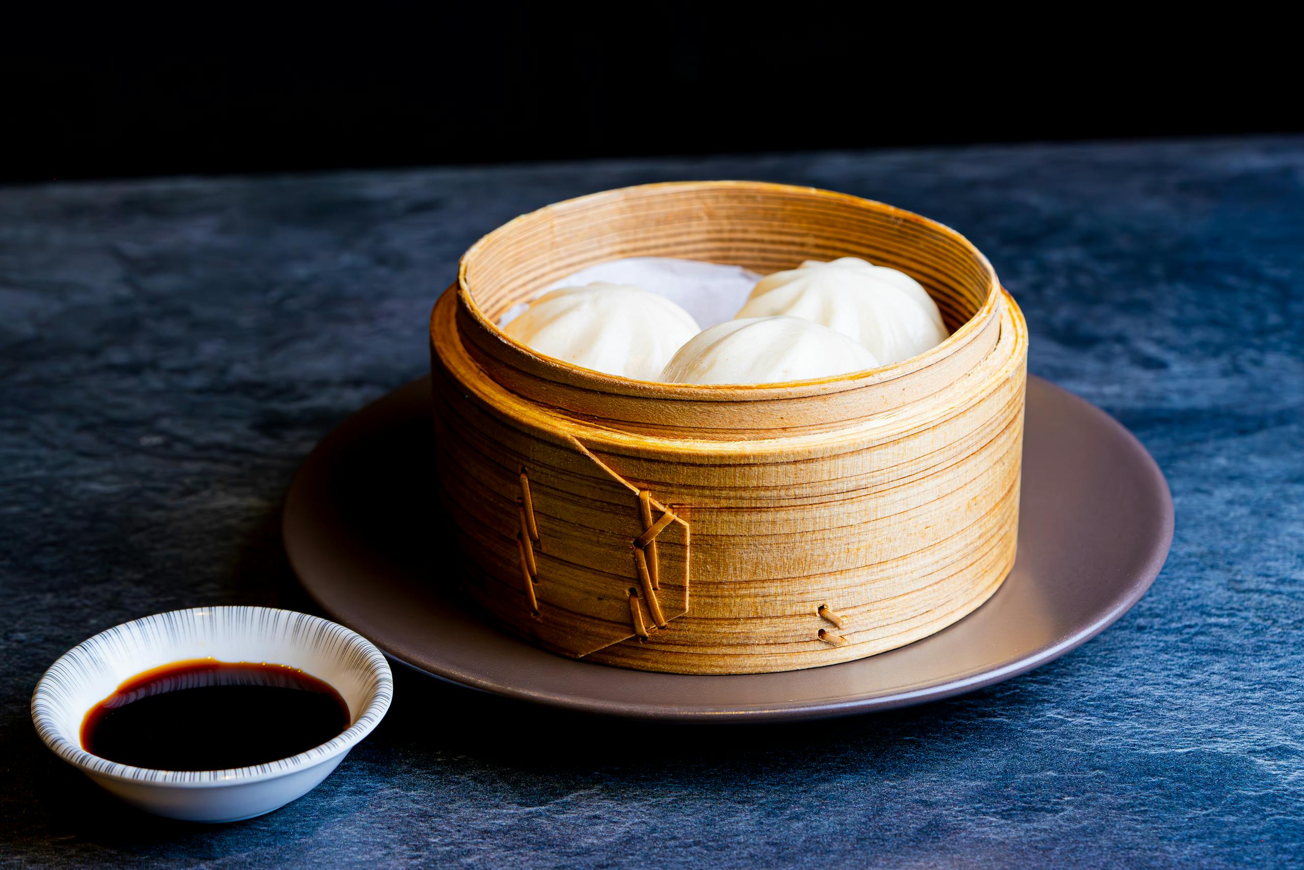 Xiaolongbao soup dumplings in bamboo steamer